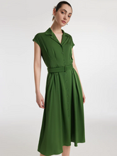 a lady in a green mulberry silk lapel midi dress with belt